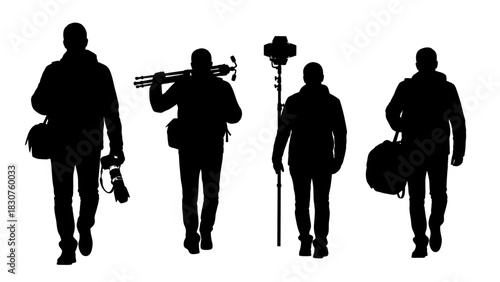 Silhouettes of four photographers carrying camera equipment and bags, walking in a line