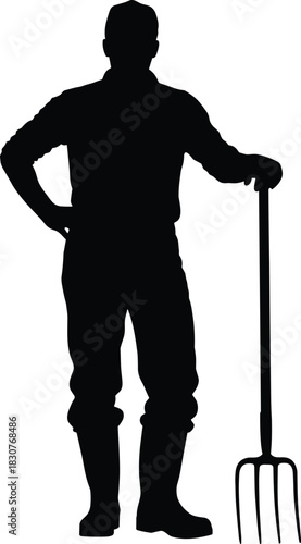 Silhouette of a farmer holding pitchfork in boots, standing confidently in rural field, symbolizing agriculture, labor, and countryside lifestyle