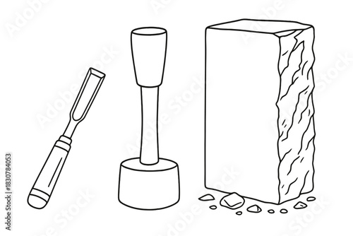 Traditional stone carving equipment including a sharp chisel and a heavy mallet with a rectangular block of marble