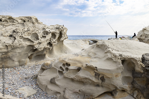 Fototapeta Naklejka Na Ścianę i Meble -  Eroded rock formations on the beach in Bordighera on the italian riviera
