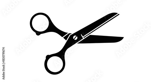 Classic black scissors open, ready for cutting, on a clean white background