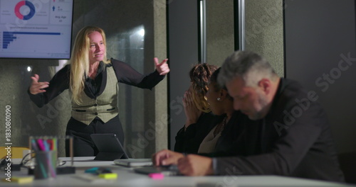 Female boss publicly scolding male employee during tense office meeting, man hides face in shame as colleagues look on, highlighting workplace conflict and humiliation