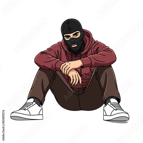 A person wearing a black balaclava and a maroon hoodie sitting on the ground.