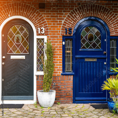 View of beautiful front doors of two neighbouring Dutch Netherlands town houses on a Dutch Street Amsterdam.