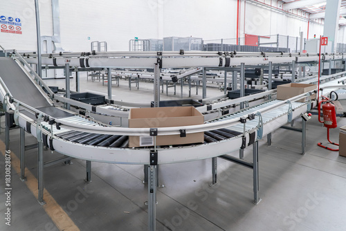 packing line in a logistics warehouse. conveyor belt in a modern production line