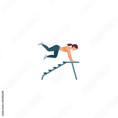 A focused brunette woman executing a plyometric push-up on gym equipment with determined