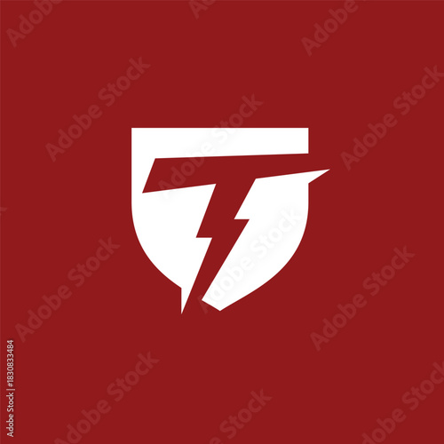 Dynamic letter T shield logo design with integrated lightning bolt, symbolizing speed, power, and protection for modern branding and corporate identity