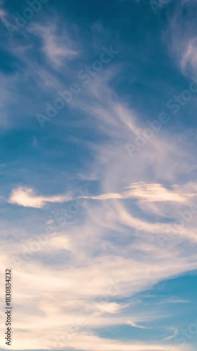 Evening sky time-lapse capturing the shift from sunset glow to nighttime darkness with subtle cloud movement.