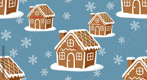 Festive seamless pattern of gingerbread houses decorated with white icing and colorful candies on a blue background with falling snowflakes.