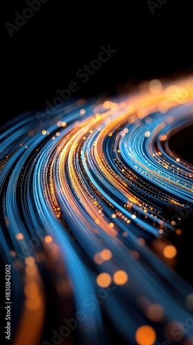 An abstract image of flowing digital data lines in blue and orange hues against a black background, suggesting movement and technology.