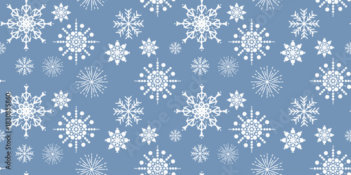 Bright seamless pattern of white snowflakes in various shapes and sizes on light blue background, ideal for winter decorations, textiles, and festive prints