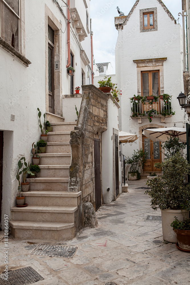 Obraz premium Locorotondo in the Apulia region of Italy. A picturesque and historic circular town. A fragment of the old town.