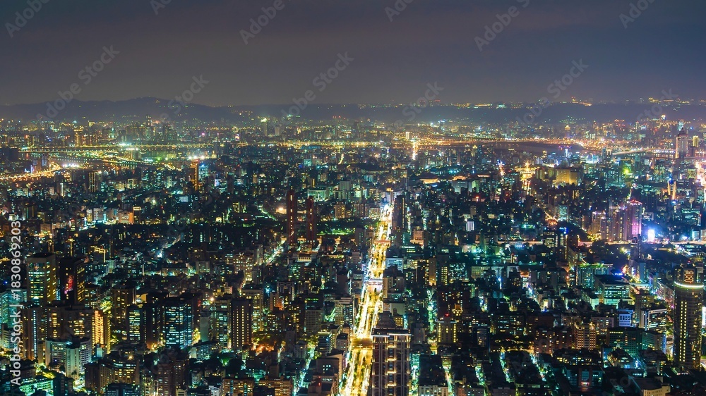 Obraz premium Vast cityscape illuminated by a million lights at night