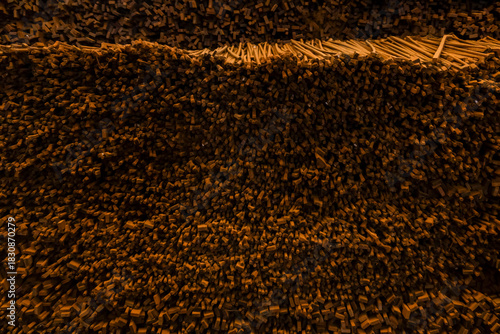 Violin bow Thin wooden sticks organized on a workbench for handcrafted production.