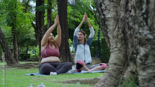 Plus size woman body positive self love exercising healthy living yoga outdoor calm focus breathing pose park morning wellness with yoga mat workout friend strength stretch green trees mindful vibe