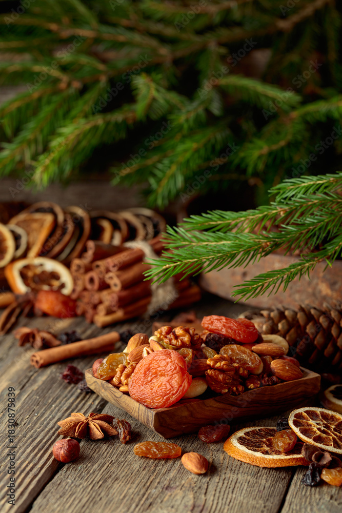 Fototapeta premium Dried fruits and nuts on an old wooden table.