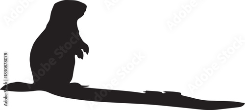 Silhouette of a prairie dog sitting upright with a long tail