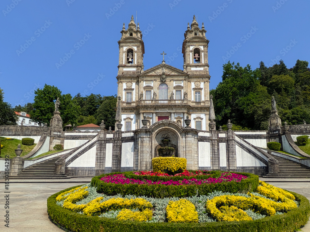 Fototapeta premium Close-up view of the pilgrimage church of Bom Jesus do Monte with flowers in front, horizontal, Braga - Portugal