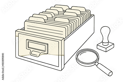 Traditional library card catalog drawer filled with index cards, magnifying glass, and rubber stamp