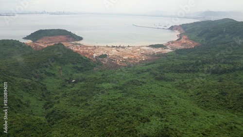 Tourism development project seen from the Hai Van Pass between Da Nang and Hue in Vietnam - destruction of a beautiful natural bay with forest destroyed to build a tourist village. Save the Planet 