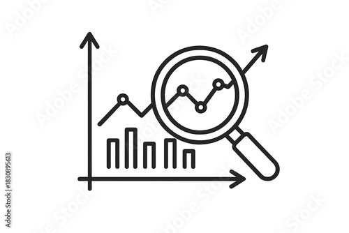 Magnifying glass analyzing financial data trends and business growth charts