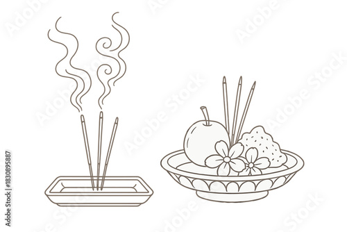 Traditional spiritual offering with burning incense sticks and a bowl of fruit and flowers