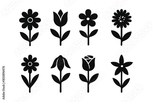 Set of eight different black and white flower icons and silhouettes for graphic design