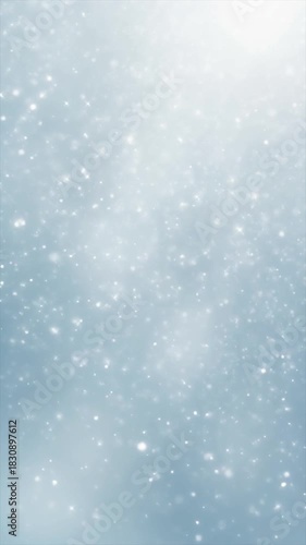 Displays a blurry view of light snow falling in winter, suitable for winterthemed backgrounds, seasonal social media posts, and holiday designs.