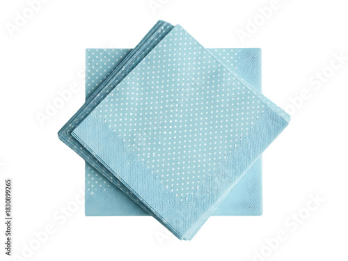 Stack of light blue paper napkins on a black background