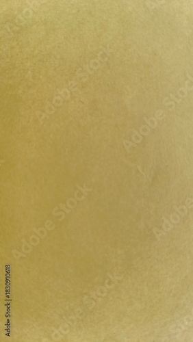 Old faded effect blank or empty yellow paper or canvas page surface texture with copy space. Simple and minimal abstract aged plane color sheet design background for banner, poster and business use.