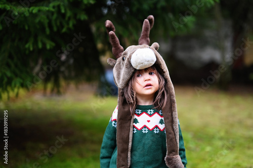 Toddler girl in deer hat