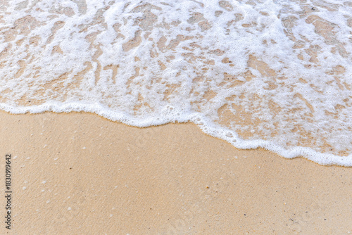 Fototapeta Naklejka Na Ścianę i Meble -  Sand beach with sea waves at coast. Copy space