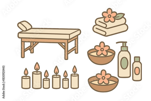 Spa treatment setup with massage table aromatic candles and folded towels