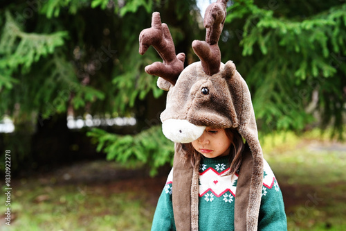 Toddler girl in deer hat
