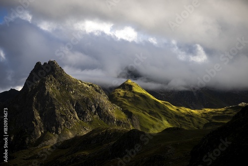 Grassy mountains with light mood and threatening clouds, Tschagguns, Rätikon, Montafon, Vorarlberg, Austria