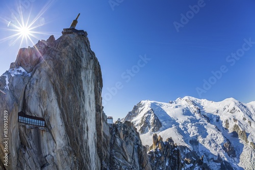 Mountain station and mountain peak with glacier in sunlight, backlight, fisheye, view of Aiguille du Midi and Mont Blanc, Mont Blanc massif, French Alps, Chamonix, France