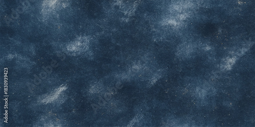 Dark grunge texture of a blue sky background with clouds and light, reminiscent of old paper and an approaching storm