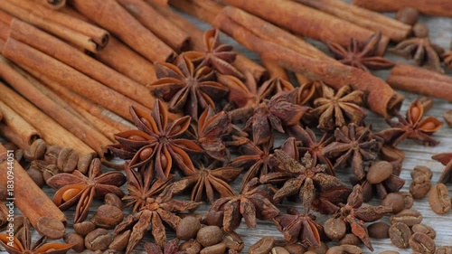 Warm Autumn and Winter Aromatic Spices with Cinnamon, Star Anise and Coffee Beans on Wooden Table for Cozy Kitchen and Holiday Mood