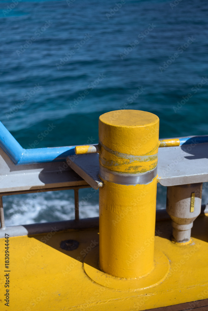 Naklejka premium yellow mooring post on boat deck