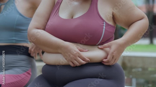 Plus size woman body positive self love exercising healthy living friends resting park bench after workout sweaty and happy urban greenery background with outdoor workout confidence focus strength