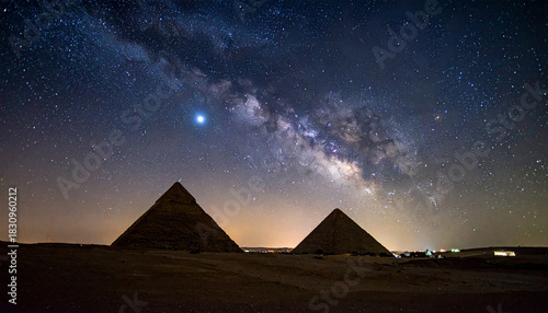 Egyptian pyramids, illuminated starry night sky with Milky Way, dramatic lighting, mystical ancient