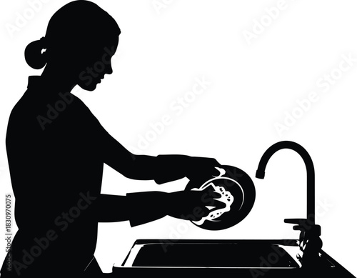 silhouette of a woman cleaning dishes in a sink