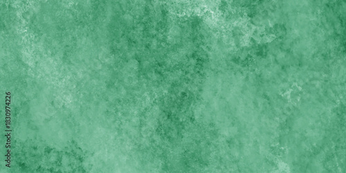 Abstract Elegant dark green background with mottled vintage texture in old fancy background design, texture of colored parchment paper.	