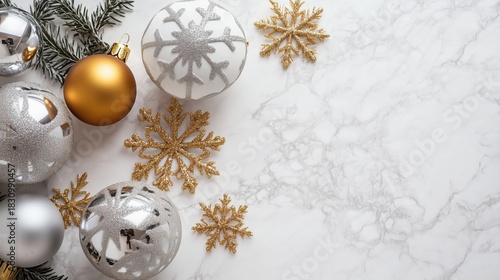 Beautiful White and Gold Christmas Ornaments Arranged on Marble Surface