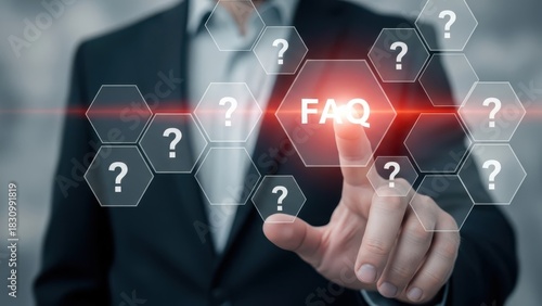 Businessman presenting FAQ concept on digital screen with question marks around