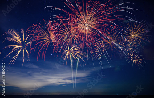 Stunning fireworks illuminate the night sky over the ocean, symbolizing celebration, hope, and the excitement of welcoming 2026 with bright new beginnings.