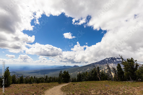 clouds over the mountains along a hiking trail