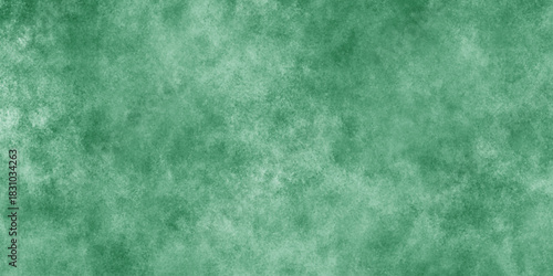 Abstract Elegant dark green background with mottled vintage texture in old fancy background design, texture of colored parchment paper.	