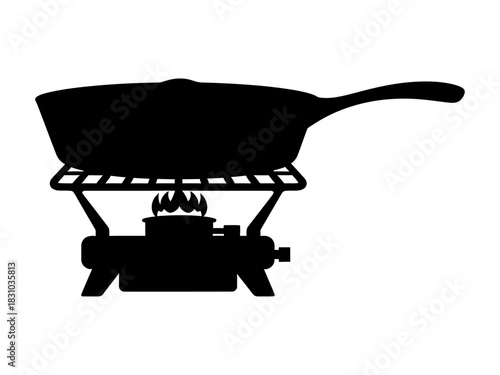Black silhouette of a frying pan cooking on a portable camping stove isolated on transparent background