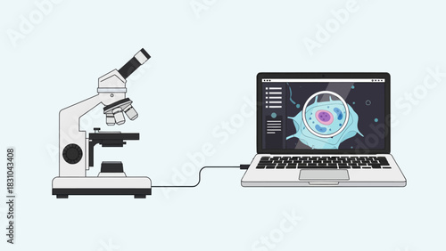 Microscope connected to a laptop displaying a cell